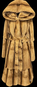A long tan fur coat with a hood and tie belt, shown against a transparent checkerboard background.
