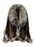 A dark brown fur coat with a large gray and white fox fur collar and matching trim, featuring a white toggle closure, shown on a checkered transparency background.