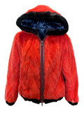 A bright red real fur hooded jacket with a dark navy blue lining inside the hood and black trim at the cuffs and hem, shown on a checkered background.