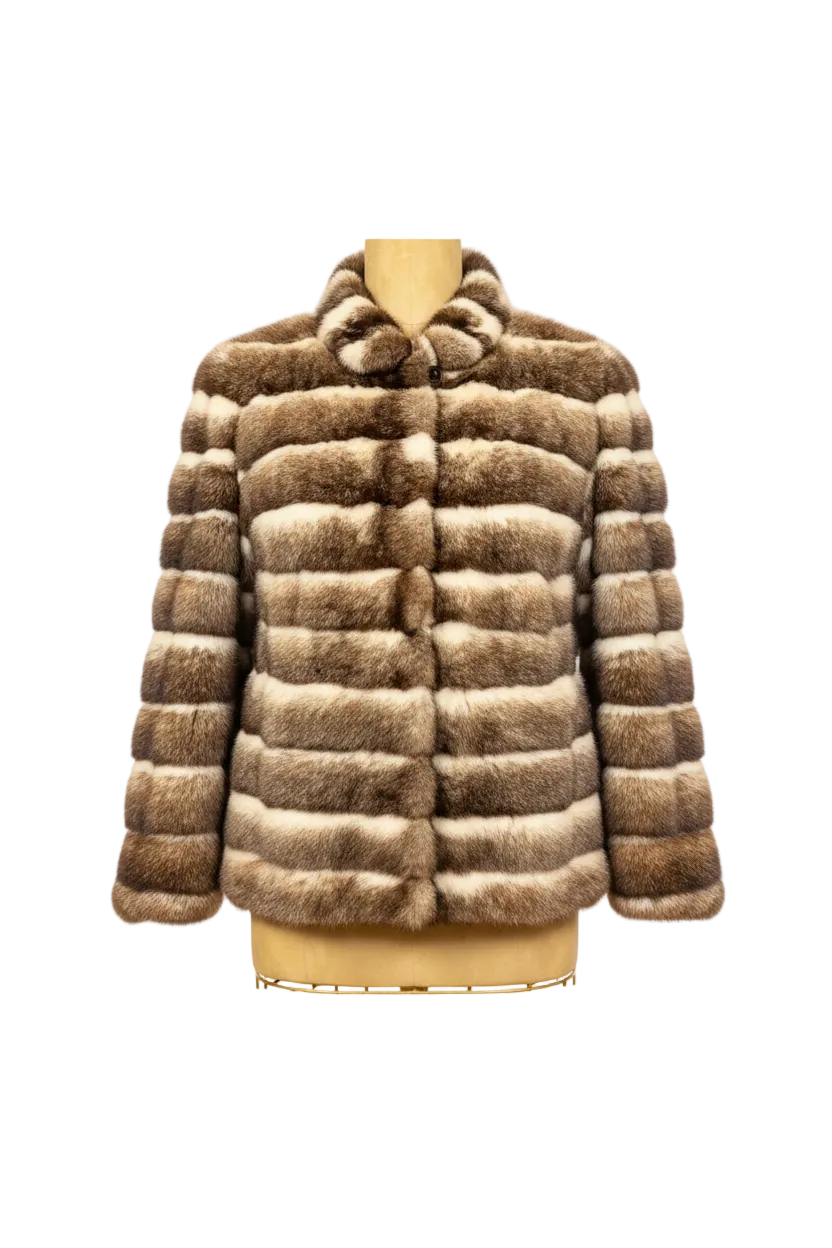 A striped fur jacket displayed on a mannequin torso against a plain white background. The jacket features alternating horizontal stripes of medium brown and cream-colored fur, with a notched collar and a button closure.