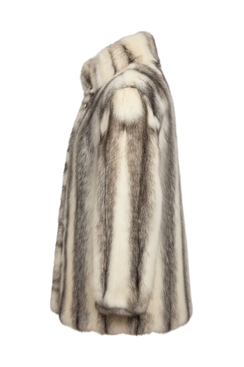 A side-profile view of a plush faux fur coat with vertical stripes in cream, beige, and gray, set against a plain white background.