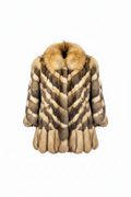 A luxury fur coat with a chevron pattern in shades of brown, beige, and cream, featuring a thick tan fur collar, shown against a plain white background.