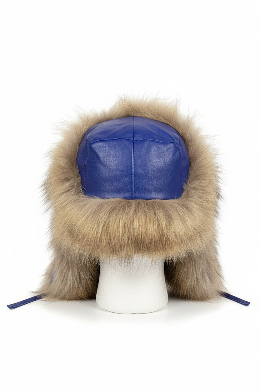 A winter trapper hat with a royal blue faux leather crown and a thick beige-brown faux fur trim, displayed on a white mannequin head against a white background.