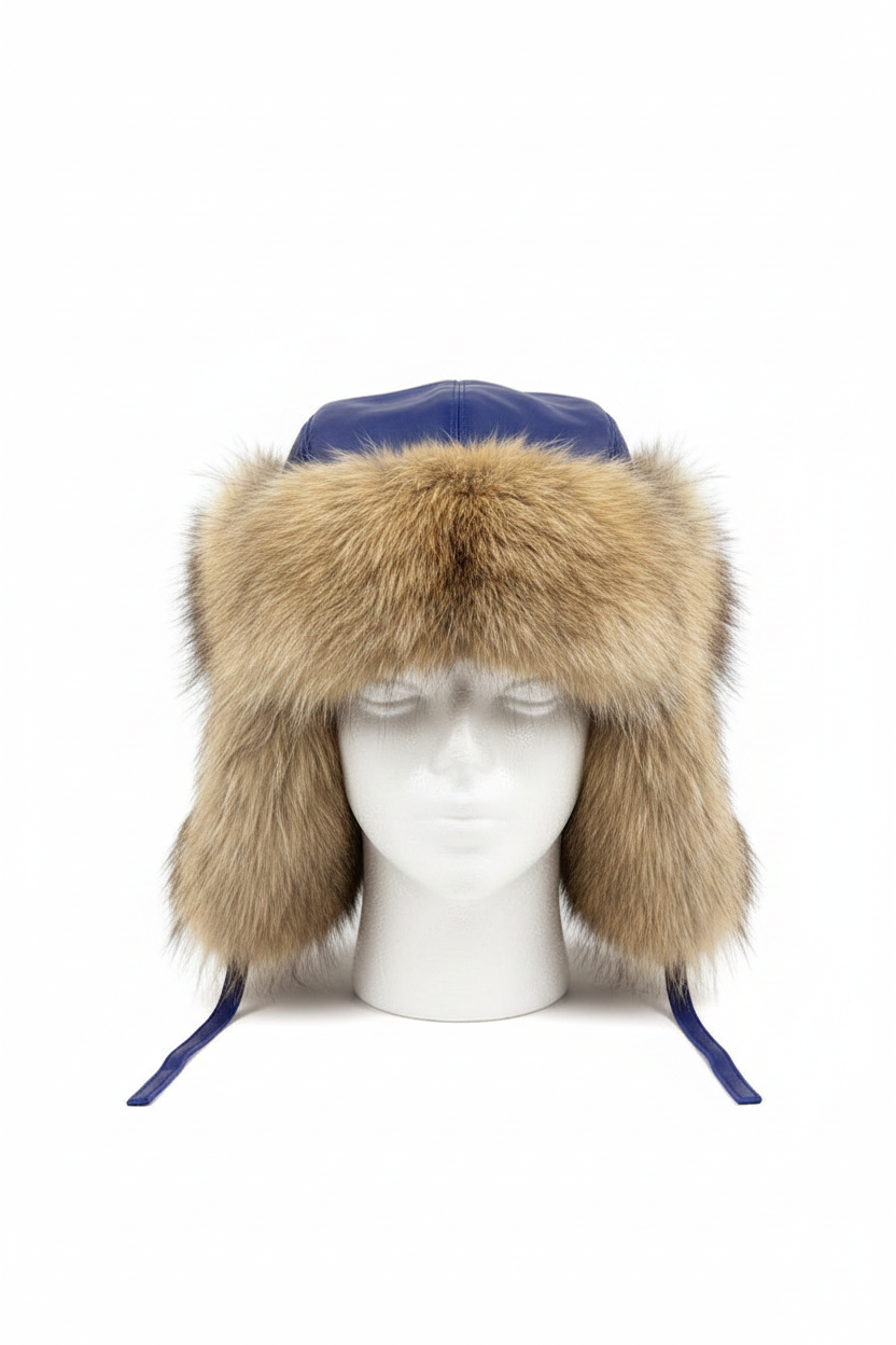 A blue leather aviator-style trapper hat with a large tan fur trim and ear flaps, displayed on a white mannequin head against a white background.