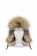 A large fur ushanka hat with brown and beige tones, displayed on a white mannequin head against a plain white background.